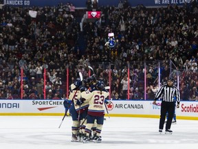 Montreal Victoire players celebrate a goal